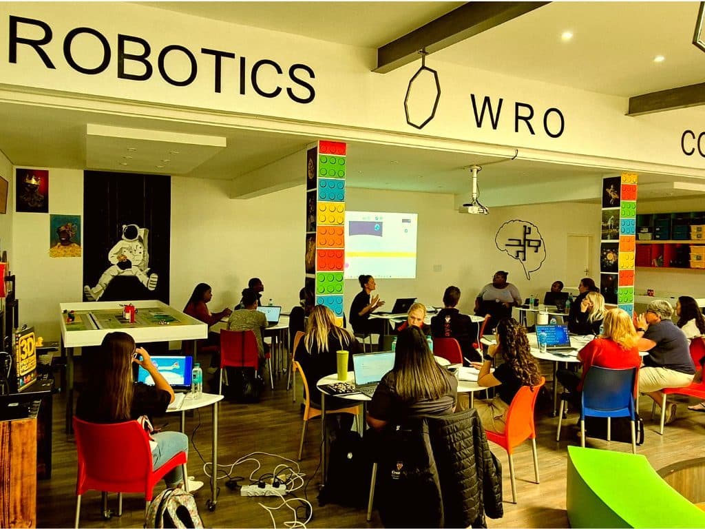 Teachers and learners in a robotics training session