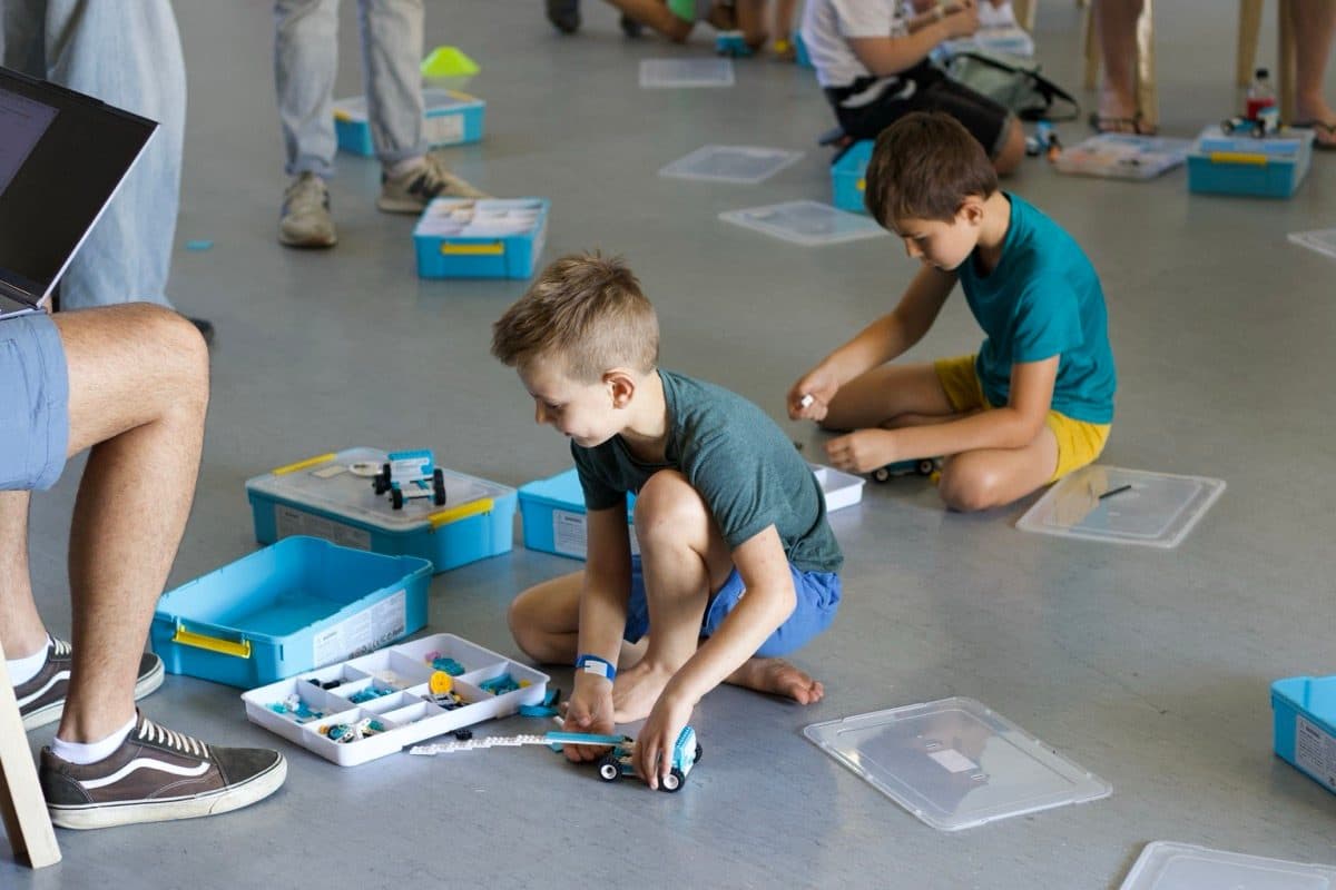 Boys testing a robot car