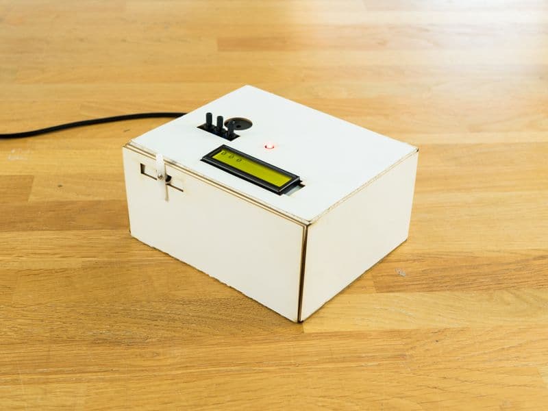Puzzle Box project — a cardboard box locked by a potentiometer combination