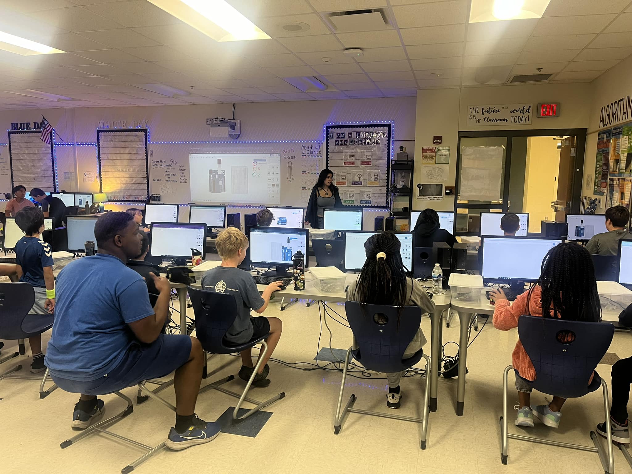 Kids working with Arduino kits in a classroom setting