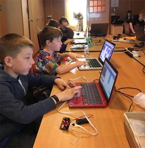 Learners at computers in a classroom using micro:bit