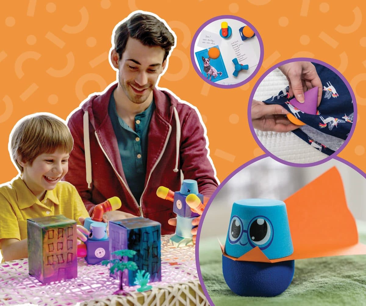 Child building imaginatively with colourful Blockaroo magnetic foam blocks