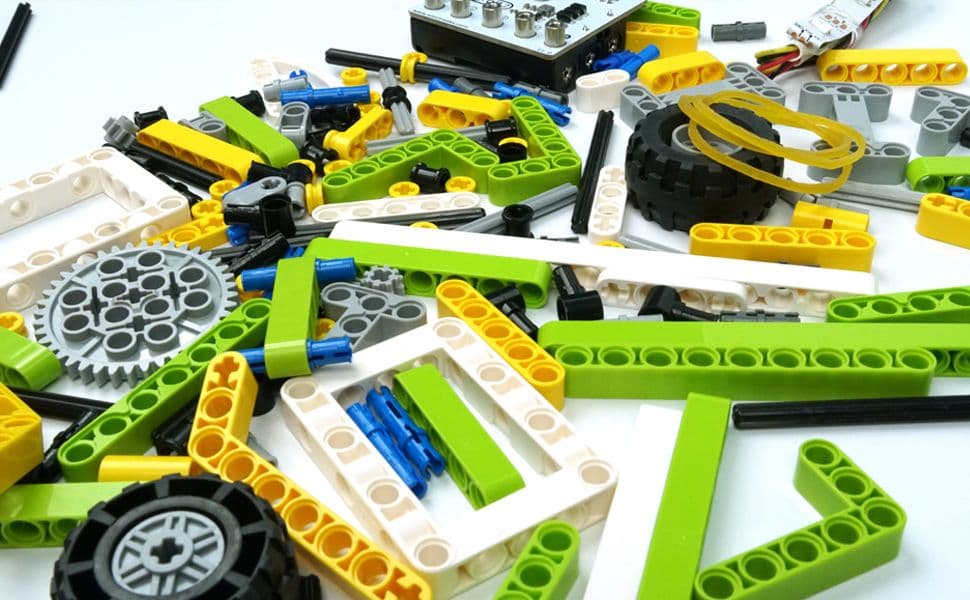 LEGO-compatible building bricks from the Ring:bit Bricks Pack scattered on a surface
