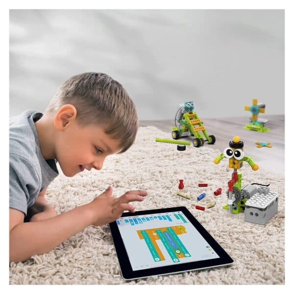 Child programming a Makerzoid robot using a tablet