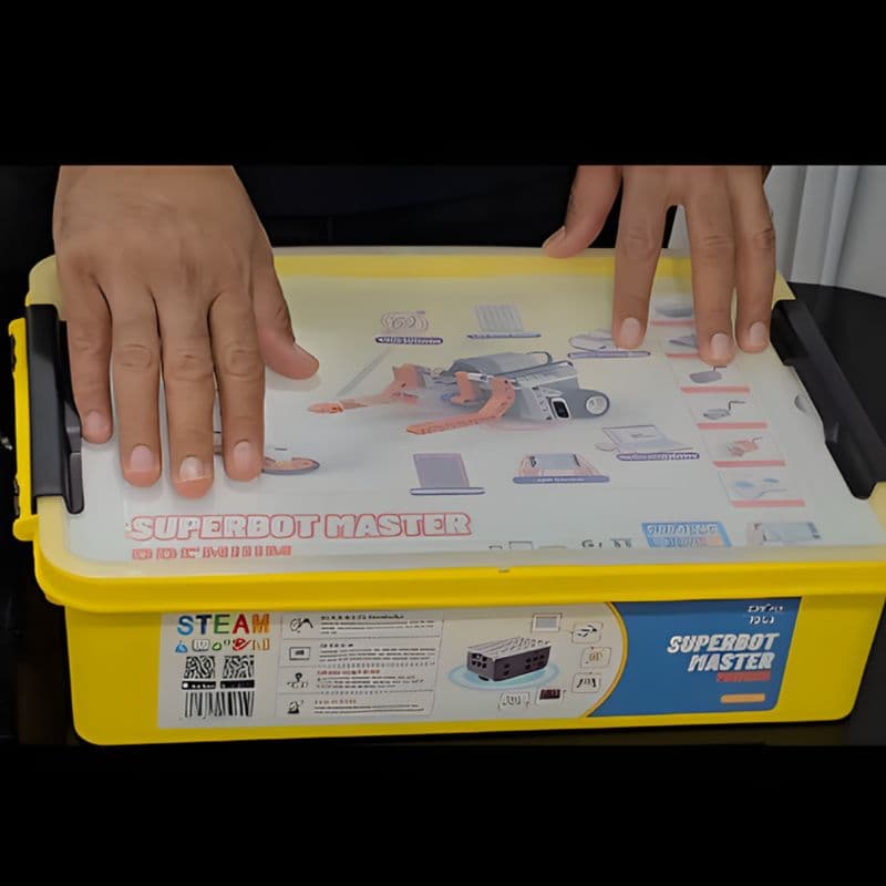 Hands holding the Makerzoid Superbot Master Premium box