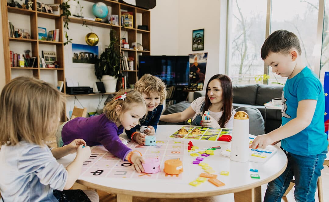 Family working together on coding challenges with MatataStudio
