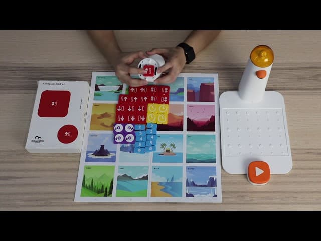 Close-up of hands arranging coding blocks