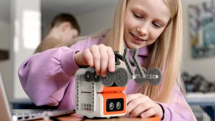 Girl playing with VinciBot robot