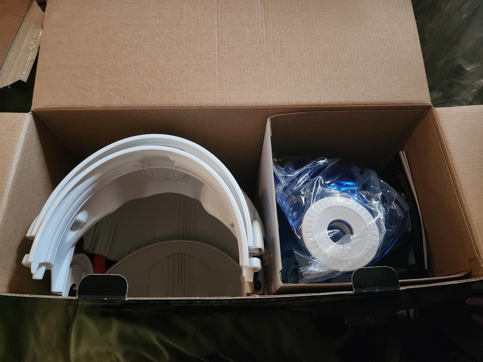 Helmet parts packed inside the opened shipping box