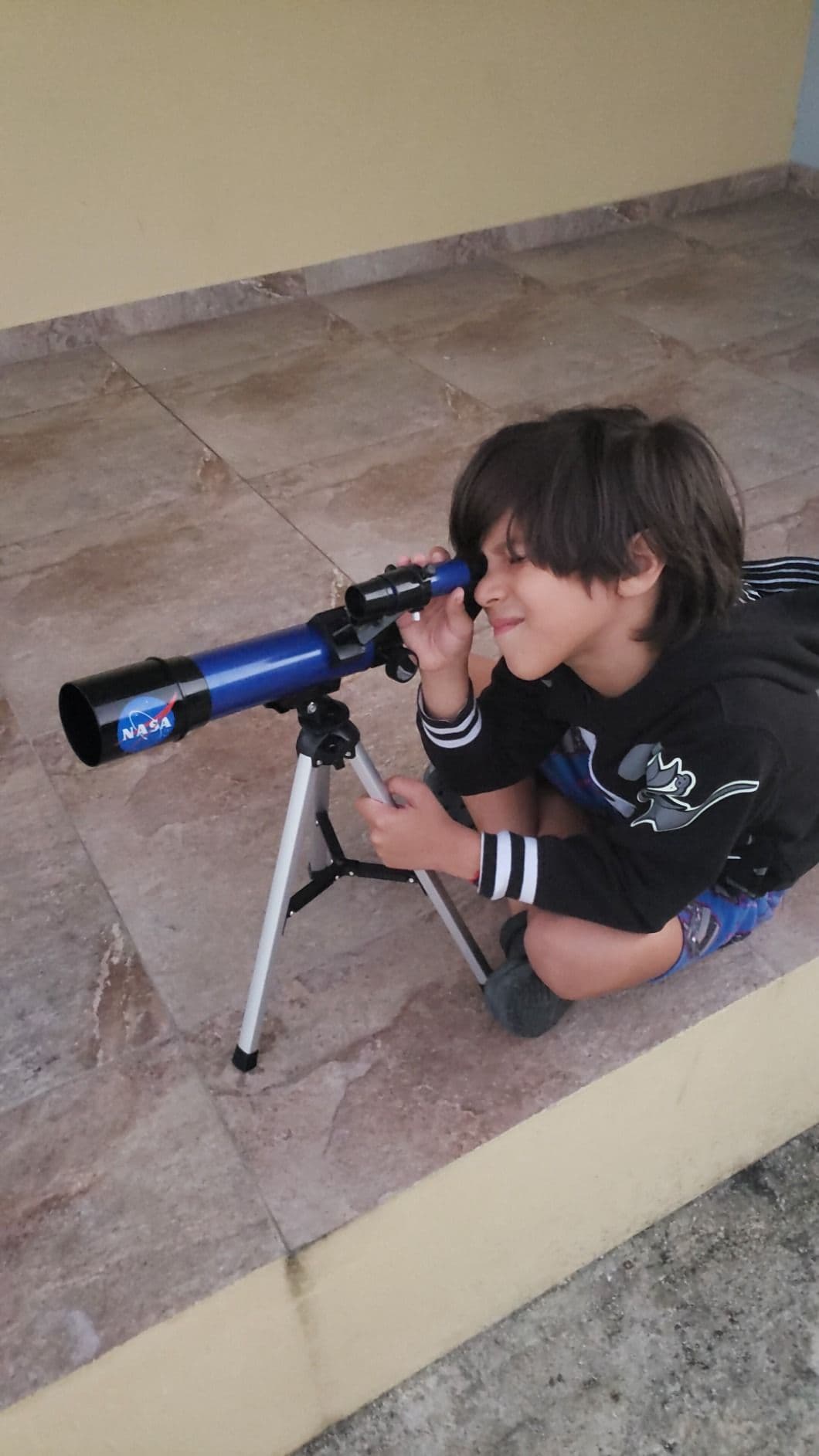 Child looking through the NASA Lunar Telescope