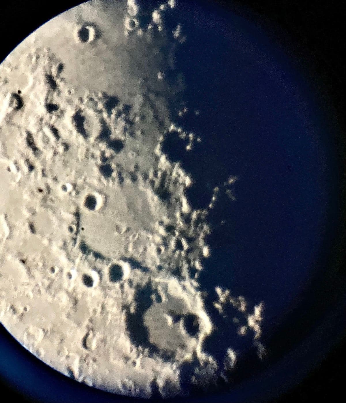 Close-up view of the moon's surface through the telescope