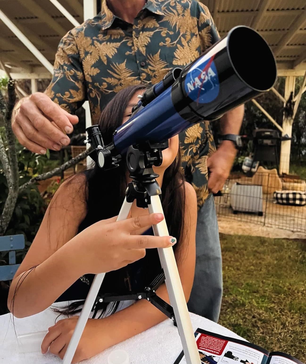 Girl independently using the NASA Lunar Telescope