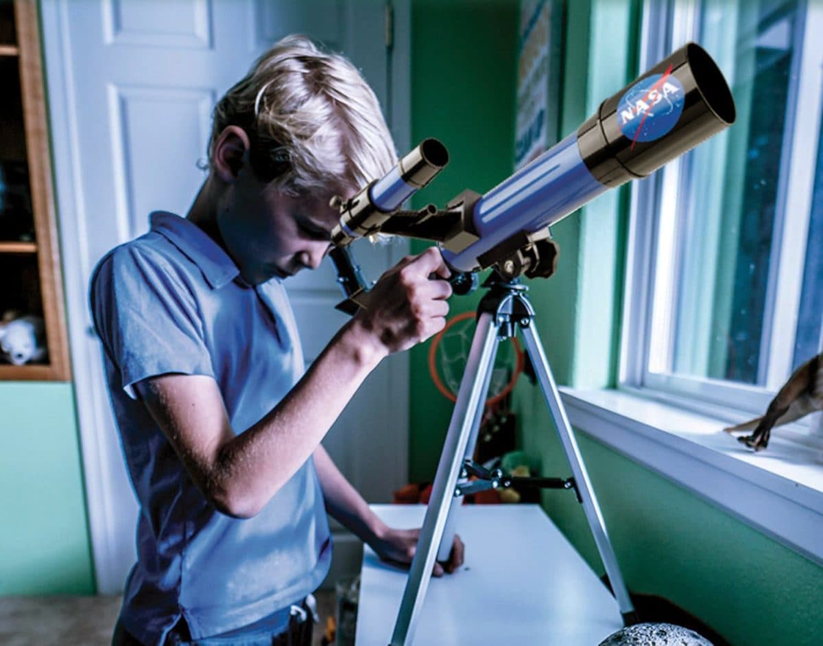 Child looking through the NASA Lunar Telescope