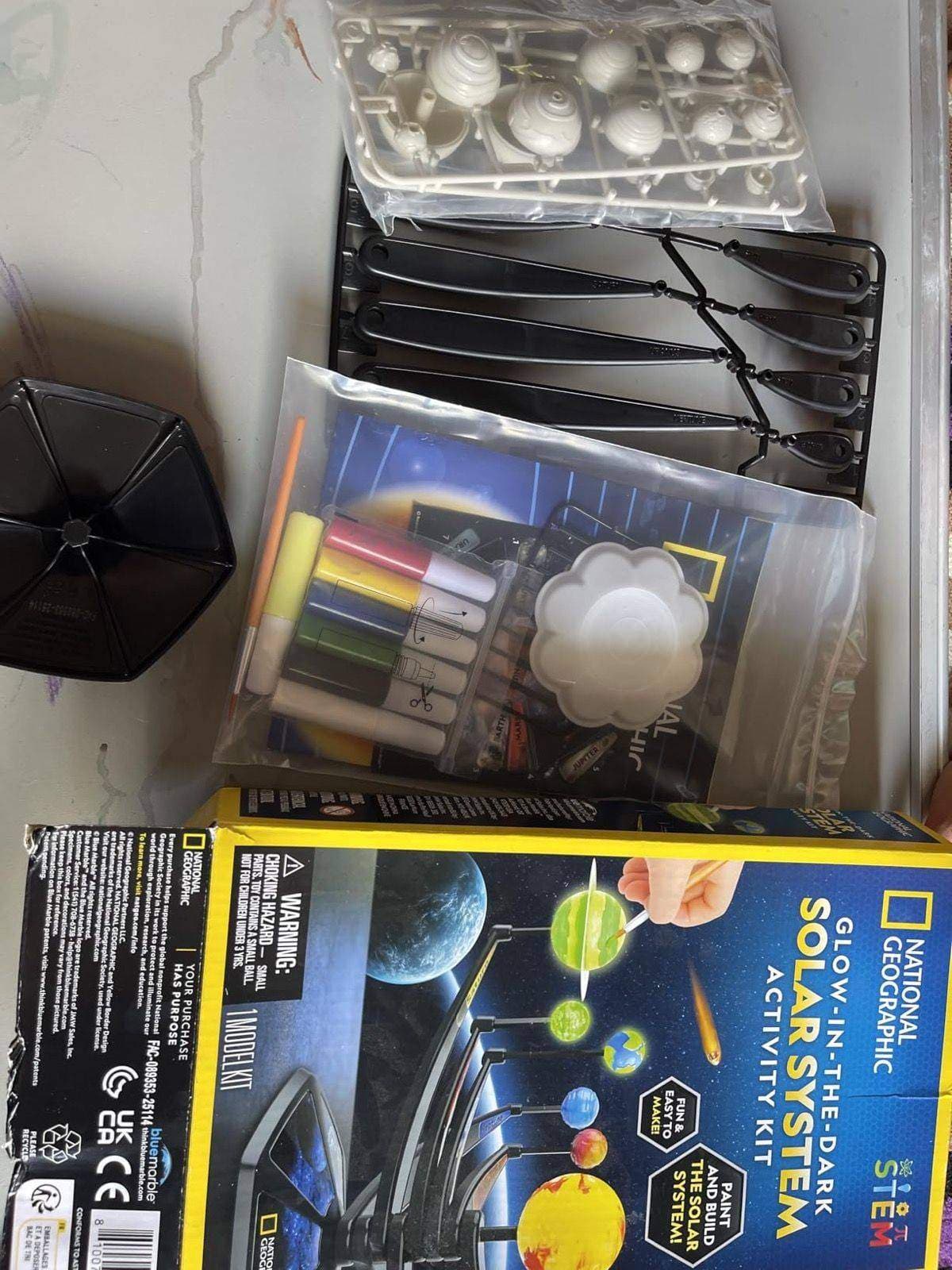 All parts of the solar system kit laid out before assembly