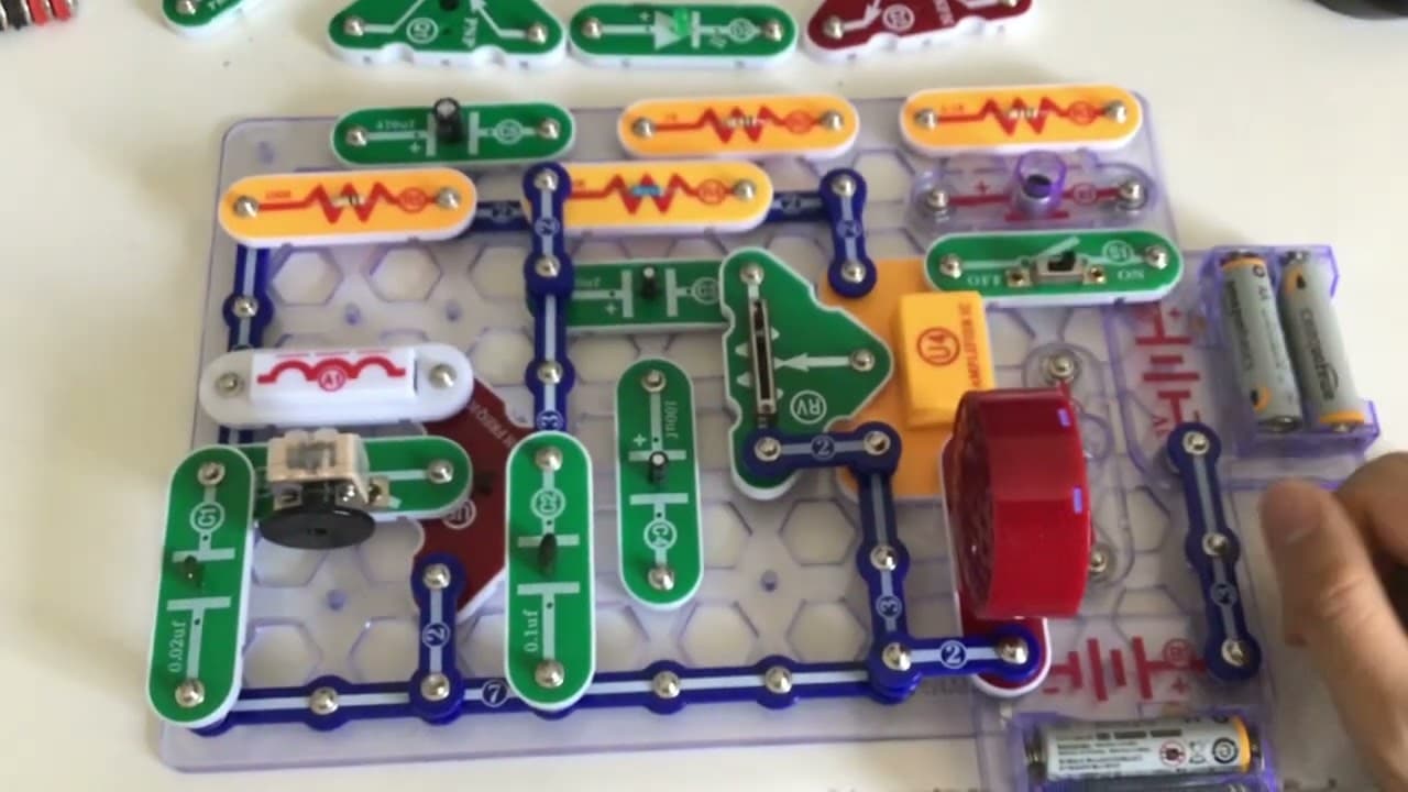 Large completed Snap Circuits project spread across a white desk