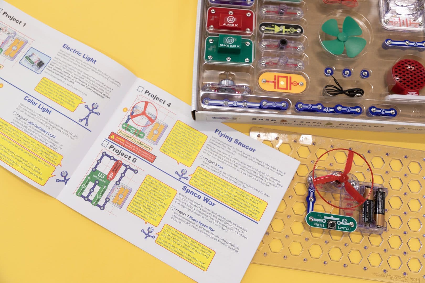 Snap Circuits box open showing the booklet and board