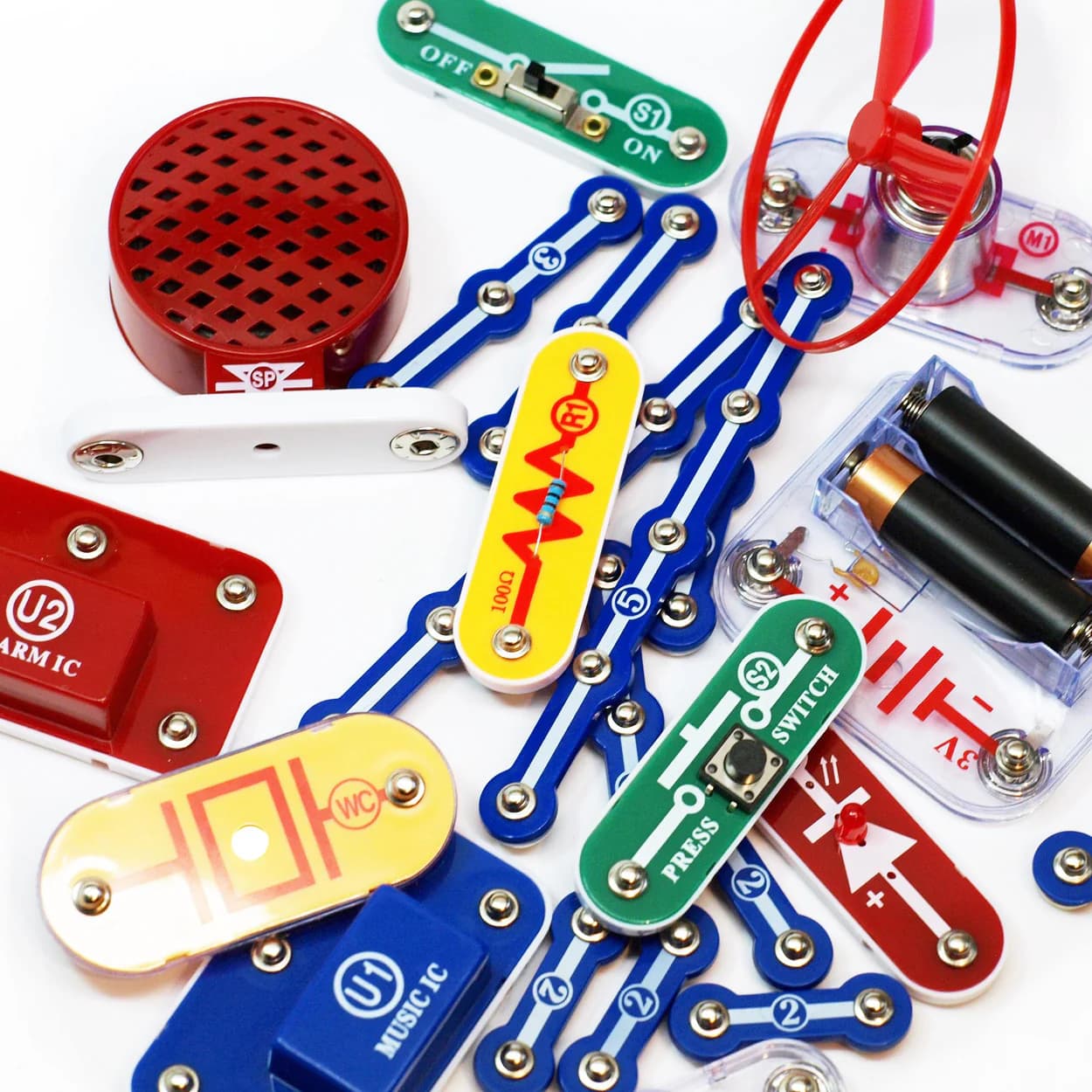 Child snapping Snap Circuits components onto the base board